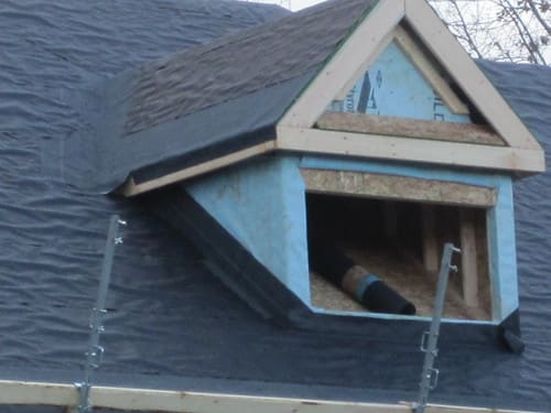 Dormer roof section with underlayment during installation