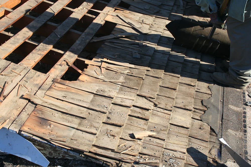Roof tear-off showing exposed roof deck